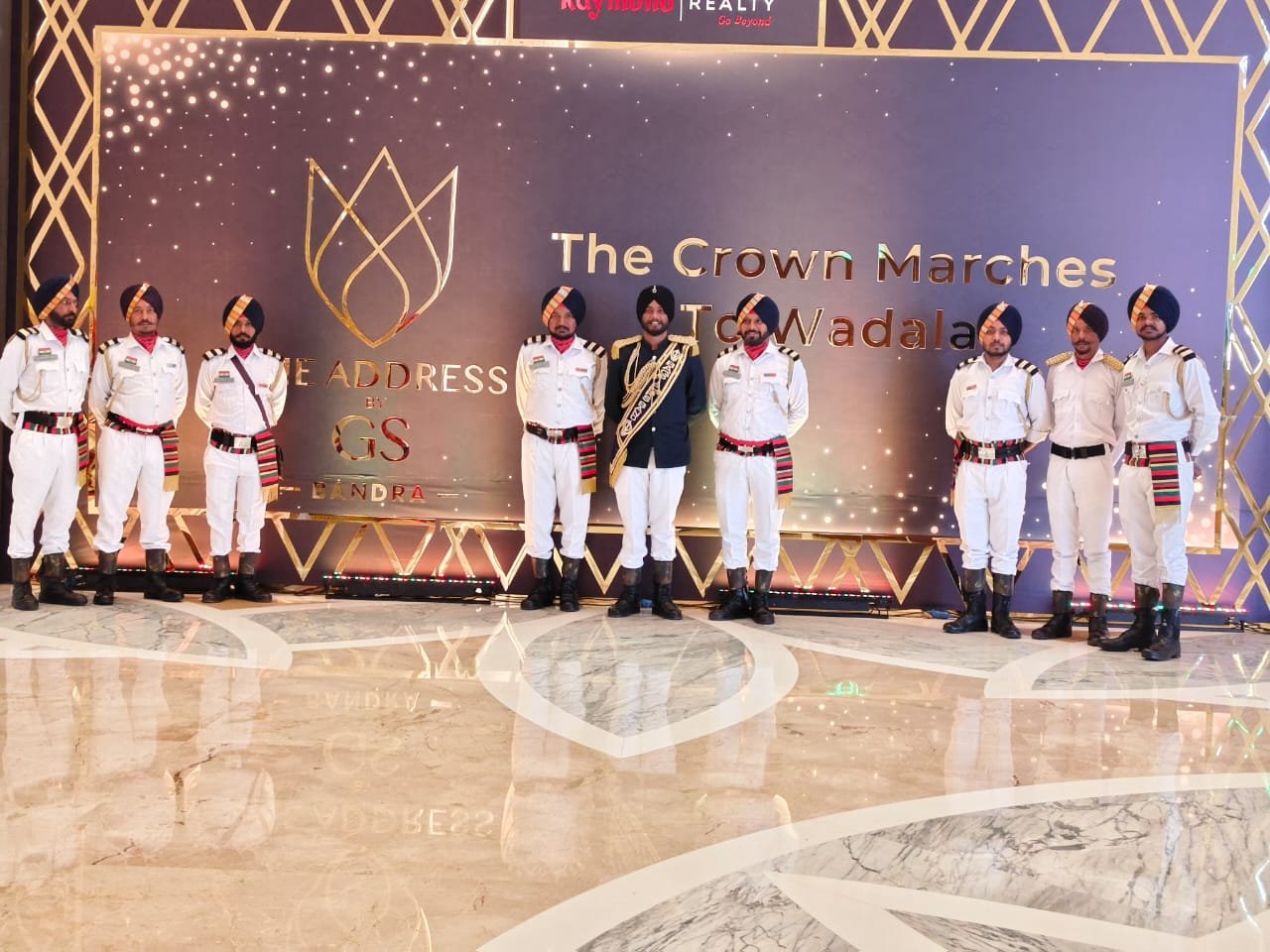 Band lined up before event backdrop