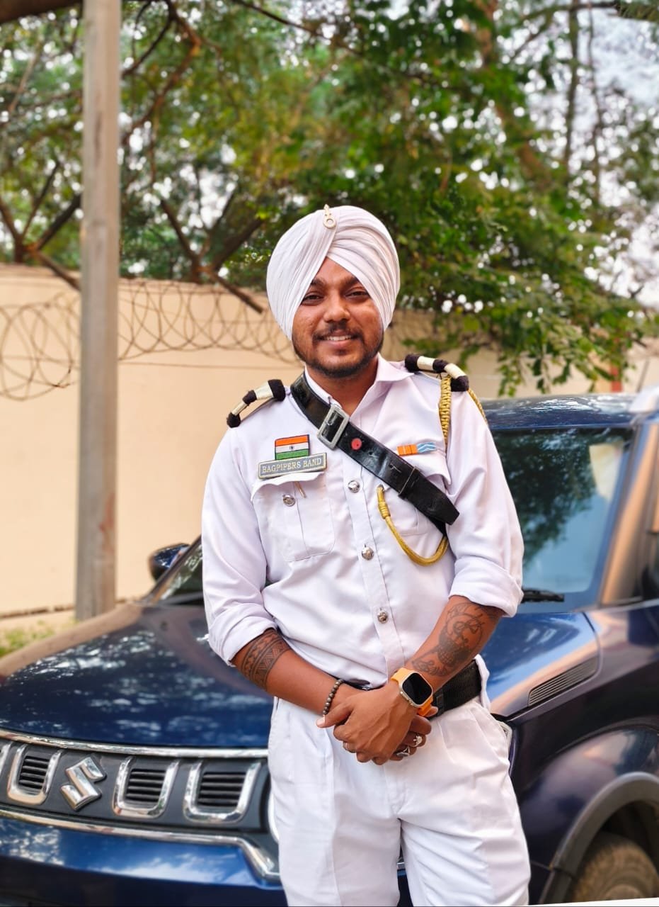 Band member in white ceremonial uniform